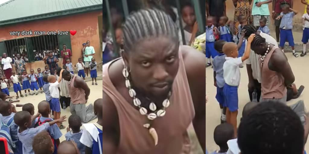 VeryDarkMan gets tongues wagging as he kneels while primary school students pray for him
