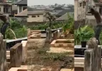 Man bathes publicly in Cemetery while standing on top of a grave